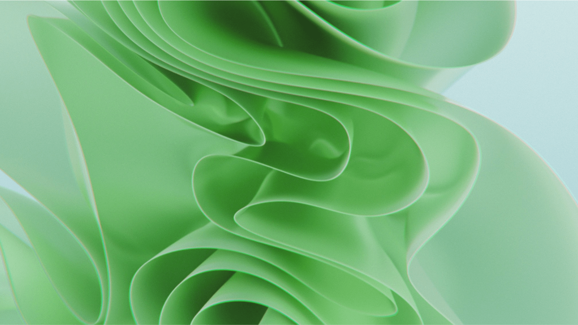 Abstract close-up of layered, flowing green shapes resembling folded paper or fabric.
