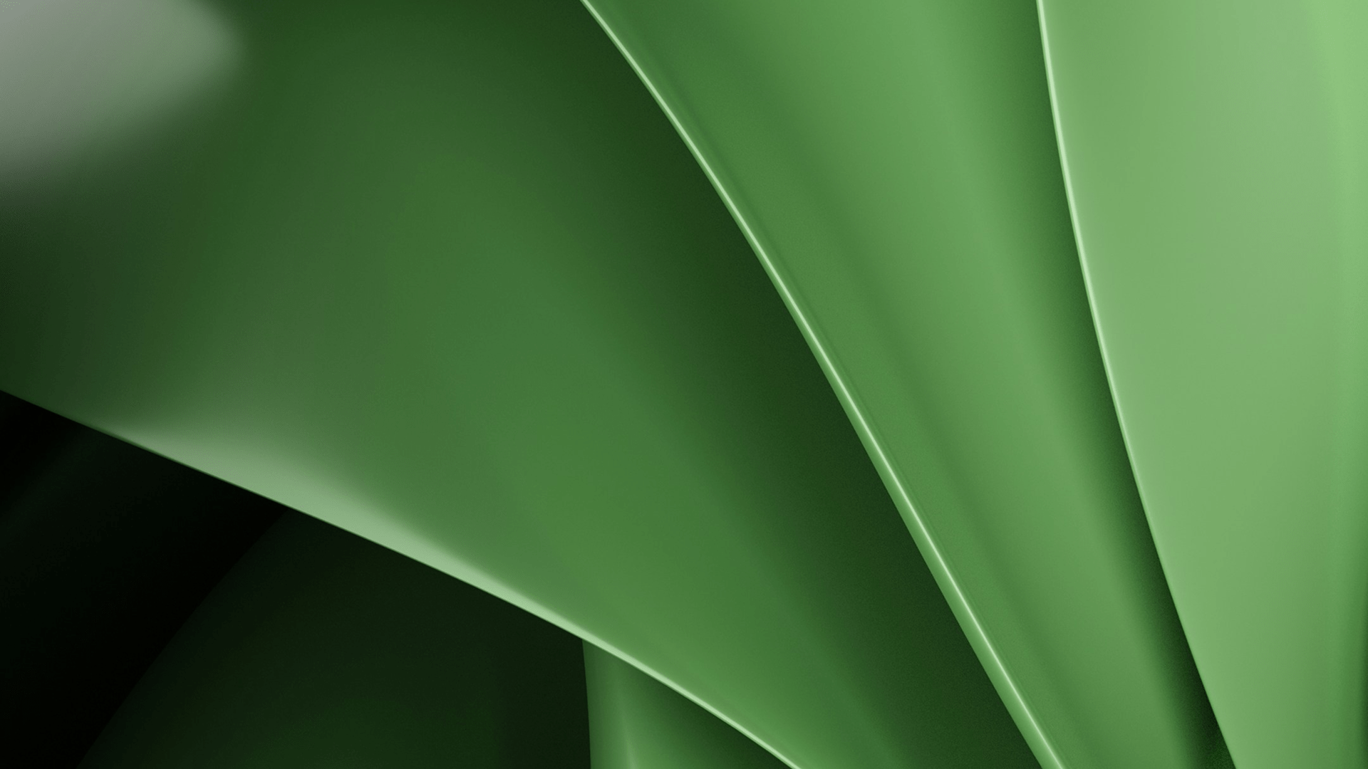 Close-up abstract view of smooth, overlapping green curved shapes with soft lighting and shadows.