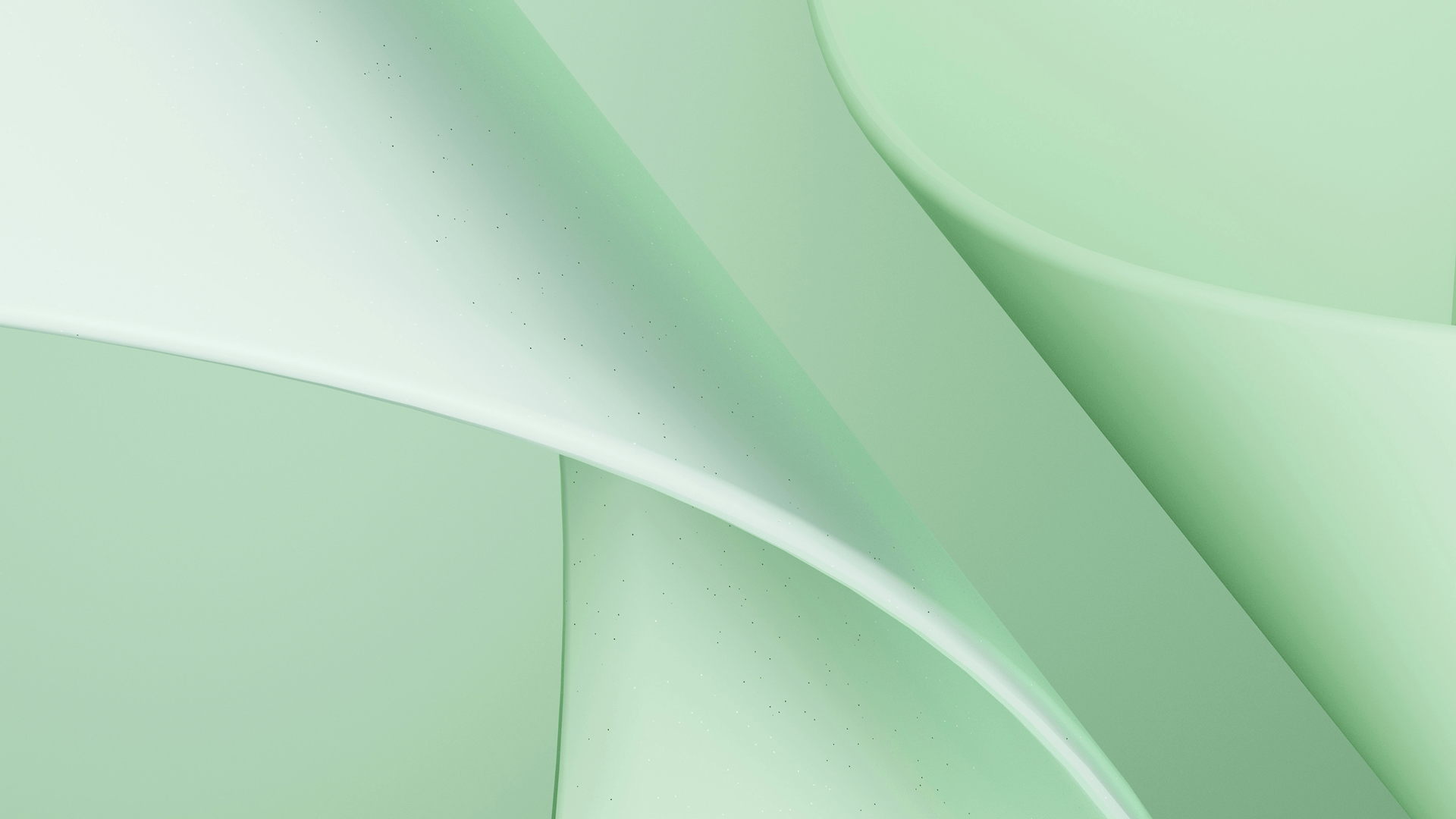 Close-up of smooth, overlapping green abstract shapes with soft gradients and shadows.